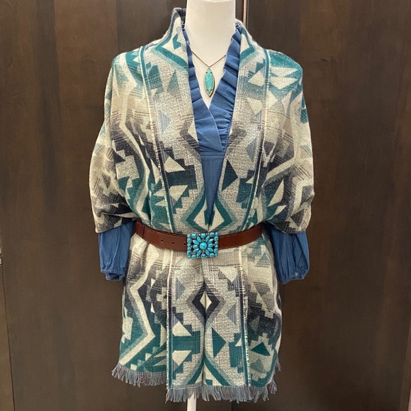 Accessories - Geometric Patterned Shawl in teal, dark blue, and gray.